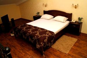 Postel nebo postele na pokoji v ubytování Hotel Meduza