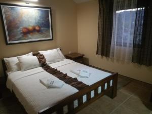 Krevet ili kreveti u jedinici u okviru objekta JOKSIM Rooms&Restaurant