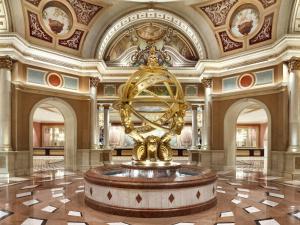 a large lobby with a fountain in the middle of a building at The Venetian® Resort Las Vegas in Las Vegas