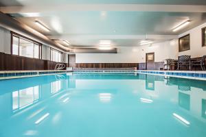 a swimming pool with blue water in a building at Third Street Inn in McCall