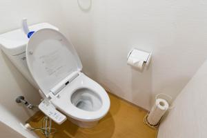 a bathroom with a white toilet in a stall at Bijou Suites Nagomi in Osaka