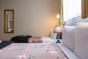 Postel nebo postele na pokoji v ubytování Strathern Motor Lodge
