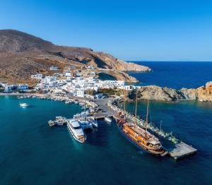 a group of boats are docked in a harbor at Vardia Bay Studios in Karavostasi