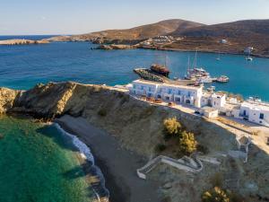 an aerial view of a white building on a cliff at Vardia Bay Studios in Karavostasi