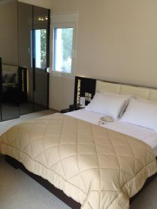 Posteľ alebo postele v izbe v ubytovaní Pearl Bay Hotel Apartments