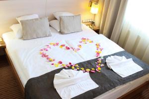 Postel nebo postele na pokoji v ubytování Hotel Famulus