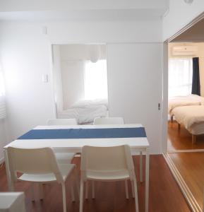 Ein Bett oder Betten in einem Zimmer der Unterkunft Izumi Apartment