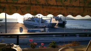 a couple of boats docked at a marina at Hotel Oscar in Igoumenitsa