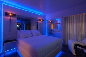 Uma cama ou camas num quarto em Motel Tropicana