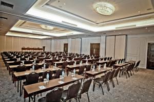 a large room with tables and chairs in it at Samala Hotel Jakarta Cengkareng in Jakarta
