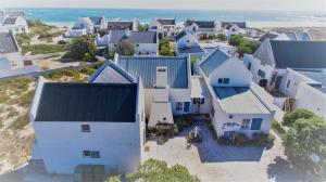 an aerial view of a town with white houses at Hocus Pocus Cottage in Paternoster