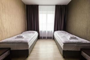 Postel nebo postele na pokoji v ubytování Hotel U Kostela