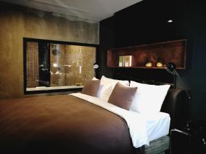 Postel nebo postele na pokoji v ubytování S Hadyai Hotel