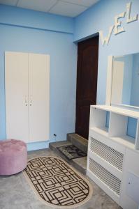 a room with a door and a room with a rug at Apartment on Sovetskaya 3 in Grodno