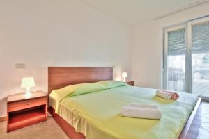 Postel nebo postele na pokoji v ubytování Apartment Katarina