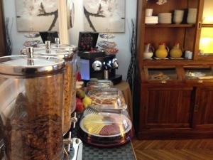 a kitchen with a buffet of food on a counter at St. Peter' Six Rooms & Suites in Rome