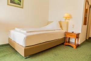 Postel nebo postele na pokoji v ubytování Familie Hopfeld - Hotel Dreikönigshof