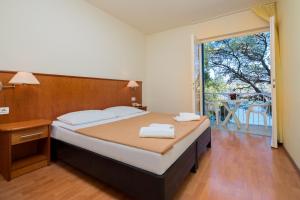 Ліжко або ліжка в номері Fontana Resort