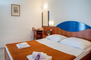 Ліжко або ліжка в номері Fontana Resort