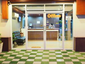an entrance to a office with a sign on the door at Bann Lhong Rak Krabi in Krabi town