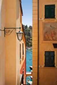 a view of a canal from between two buildings at Splendido, A Belmond Hotel, Portofino in Portofino