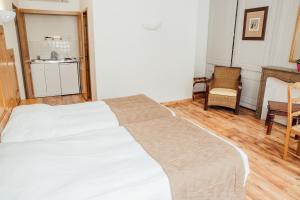 Postel nebo postele na pokoji v ubytování Appart Hotel Charles Sander