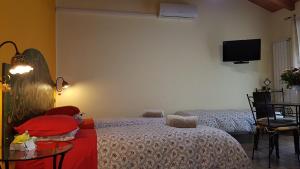 Postel nebo postele na pokoji v ubytování B&B La Tartaruga