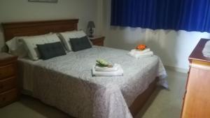 A bed or beds in a room at Sol Paraiso