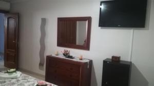 A television and/or entertainment centre at Sol Paraiso