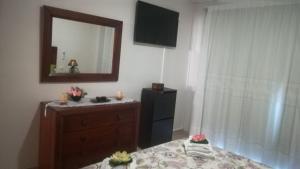 A bed or beds in a room at Sol Paraiso
