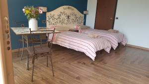 Postel nebo postele na pokoji v ubytování B&B La Tartaruga