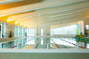 a swimming pool in a building with a swimming pool at Godby Vandrarhem in Godby +19 photos