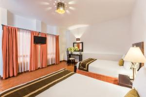 Postel nebo postele na pokoji v ubytování Hotel Casa Virreyes
