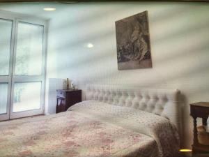 Posteľ alebo postele v izbe v ubytovaní Casa con giardino