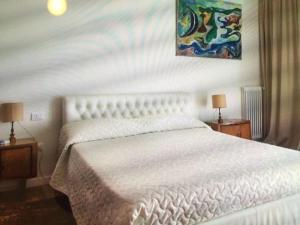 Posteľ alebo postele v izbe v ubytovaní Casa con giardino