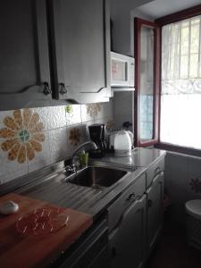 Kjøkken eller kjøkkenkrok på Sassipiantati Home Holidays