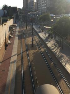 a set of train tracks on a city street at First line Apartment in Alicante