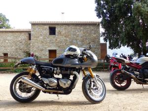 two motorcycles parked in front of a building at Maison d'Hôtes Zella in Bains de Guitera