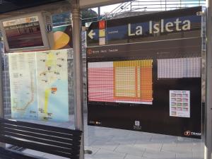 a sign at a train station with a map at First line Apartment in Alicante