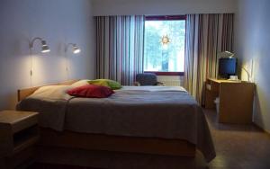 Ένα ή περισσότερα κρεβάτια σε δωμάτιο στο Karemajat Panorama hotel