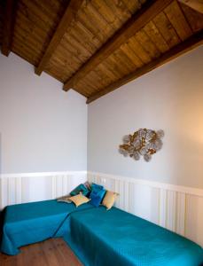A bed or beds in a room at Rincón de San Cayetano