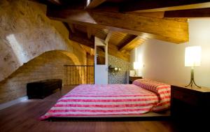 A bed or beds in a room at Rincón de San Cayetano