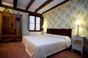 A bed or beds in a room at Rincón de San Cayetano