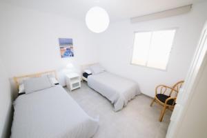 Postel nebo postele na pokoji v ubytování Apartamentos Ocean View