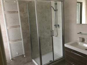 a shower with a glass door in a bathroom at Agriturismo La Rinaldina in Faenza +97 photos