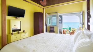 Postel nebo postele na pokoji v ubytování Luna Sea Inn