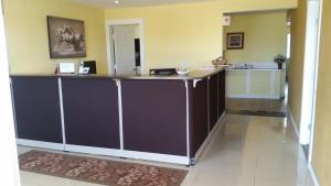 a lobby with a large counter in a hospital at Melville Country Inn in Melville