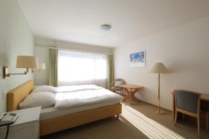 Postel nebo postele na pokoji v ubytování Hotel Concordia