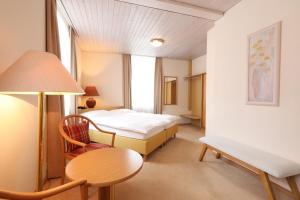 Postel nebo postele na pokoji v ubytování Hotel Concordia