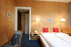 Postel nebo postele na pokoji v ubytování Hotel Concordia
